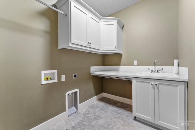 1031 E Reflect Ridge Dr, Meridian, ID 83642 - clothes washing area featuring cabinet space, electric dryer hookup, hookup for a washing machine, and baseboards