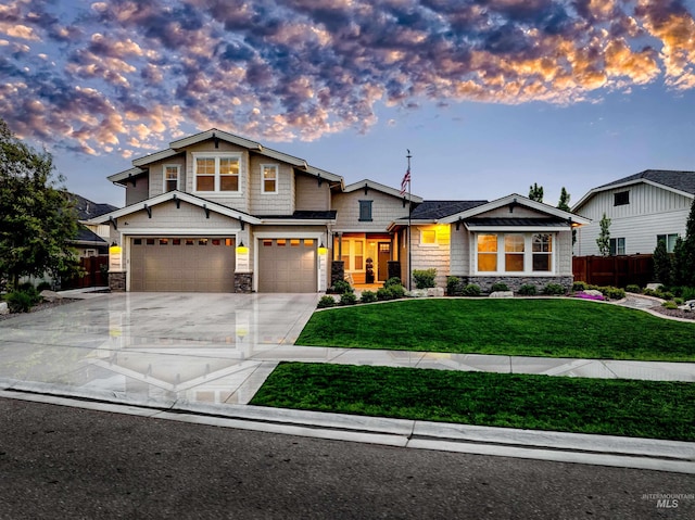 5853 W Venetian Dr, Eagle, ID 83616 - view of front of property featuring stone siding, an attached garage, and concrete driveway