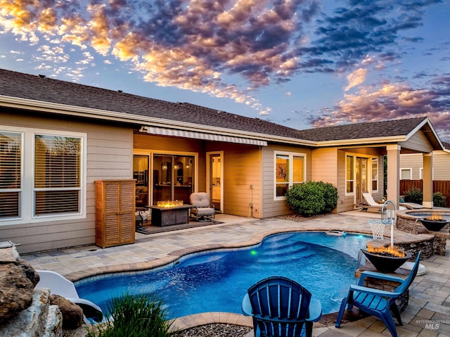 5853 W Venetian Dr, Eagle, ID 83616 - outdoor pool with an outdoor fire pit and a patio