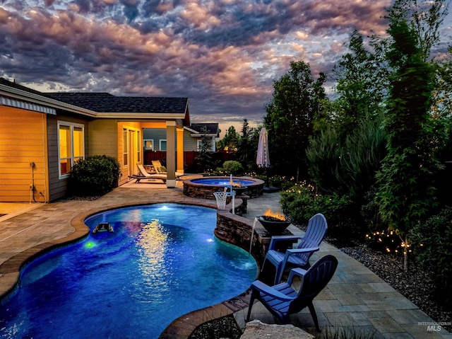 5853 W Venetian Dr, Eagle, ID 83616 - pool at dusk with an outdoor fire pit, a patio area, an in-ground hot tub, and an outdoor pool