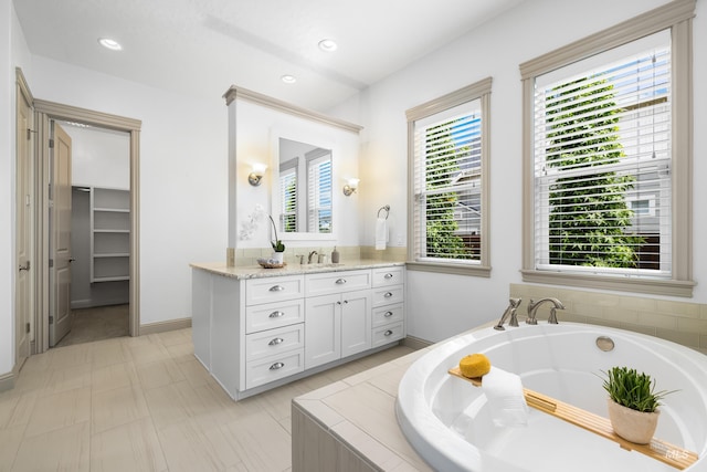 5853 W Venetian Dr, Eagle, ID 83616 - full bathroom with a garden tub, vanity, baseboards, and recessed lighting