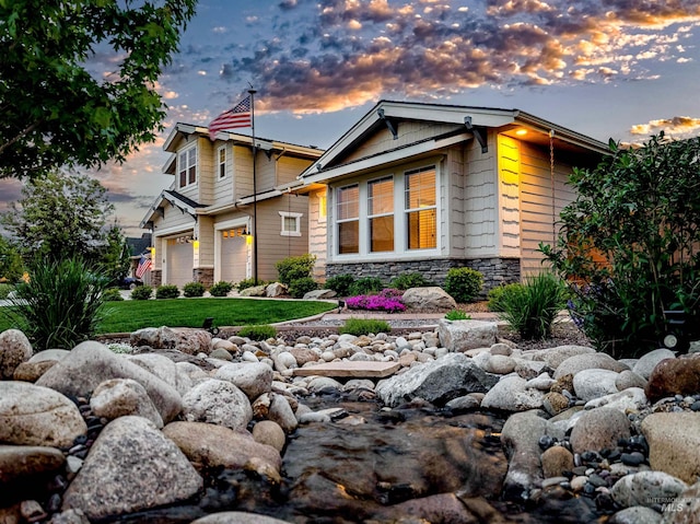 5853 W Venetian Dr, Eagle, ID 83616 - craftsman-style home with stone siding, a garage, and a front yard