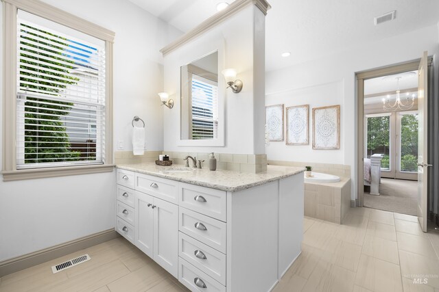 5853 W Venetian Dr, Eagle, ID 83616 - bathroom featuring healthy amount of natural light, vanity, and a chandelier