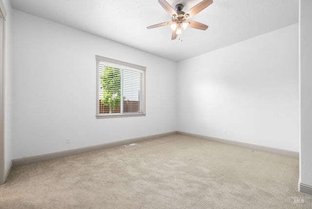 5853 W Venetian Dr, Eagle, ID 83616 - empty room featuring light carpet, baseboards, and ceiling fan
