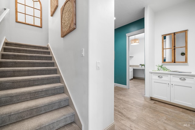 5853 W Venetian Dr, Eagle, ID 83616 - stairs with wood finished floors and baseboards