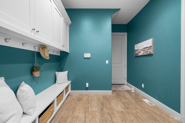 5853 W Venetian Dr, Eagle, ID 83616 - mudroom featuring light wood-style flooring and baseboards