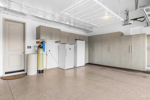 5853 W Venetian Dr, Eagle, ID 83616 - garage with freestanding refrigerator and a garage door opener
