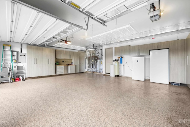5853 W Venetian Dr, Eagle, ID 83616 - garage with a garage door opener and freestanding refrigerator