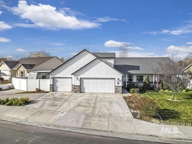 view of front of property featuring a garage and a front yard