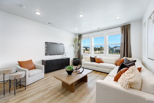 living room with light hardwood / wood-style floors