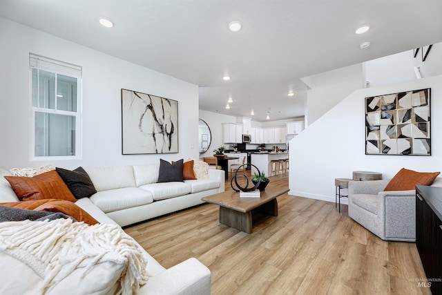 living room with light hardwood / wood-style flooring