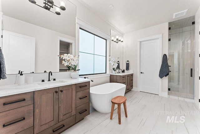 1195 N Arrano Farms Ln, Eagle, ID 83616 - bathroom featuring two vanities, a stall shower, and a freestanding tub