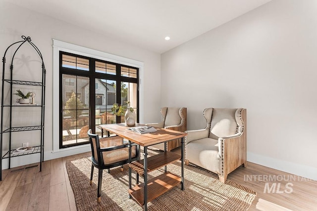 1195 N Arrano Farms Ln, Eagle, ID 83616 - dining space with light wood finished floors, an office area, baseboards, and recessed lighting