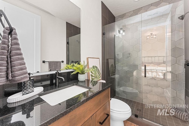 1195 N Arrano Farms Ln, Eagle, ID 83616 - bathroom with vanity, toilet, and a shower stall