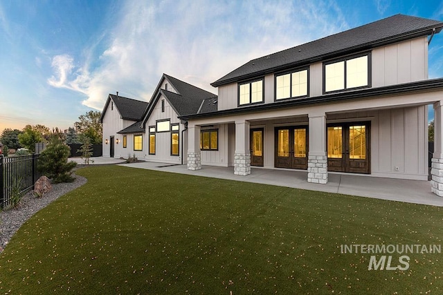 1195 N Arrano Farms Ln, Eagle, ID 83616 - back of property featuring french doors, board and batten siding, a patio area, and roof with shingles