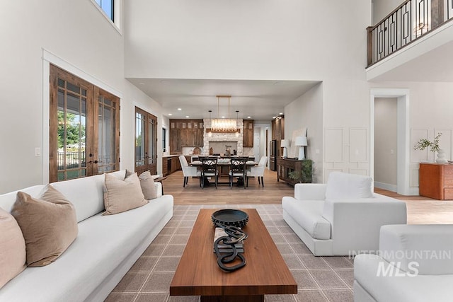 1195 N Arrano Farms Ln, Eagle, ID 83616 - living area featuring a towering ceiling, wood finished floors, and french doors