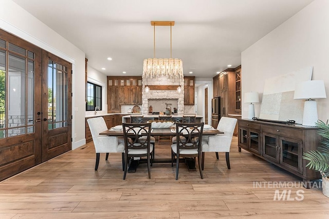 1195 N Arrano Farms Ln, Eagle, ID 83616 - dining space featuring french doors, light wood-style floors, recessed lighting, and baseboards