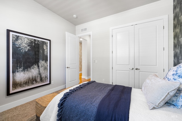 bedroom with baseboards, a closet, and visible vents