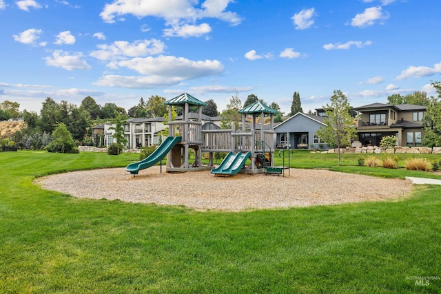 communal playground featuring a lawn