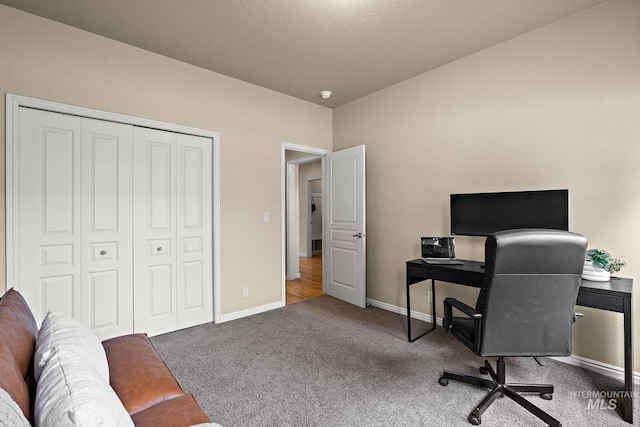 office area featuring carpet flooring and baseboards