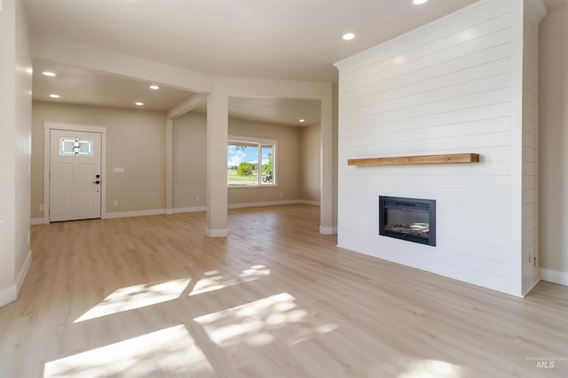 4320 SW 2nd Ave, New Plymouth, ID 83655 - unfurnished living room featuring light wood finished floors, a large fireplace, and recessed lighting