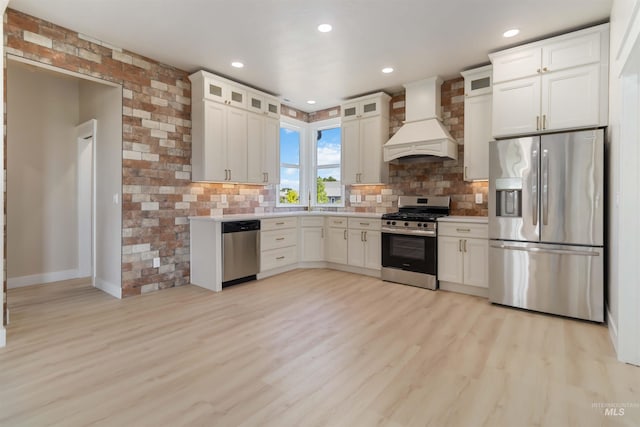 4320 SW 2nd Ave, New Plymouth, ID 83655 - kitchen featuring appliances with stainless steel finishes, custom range hood, tasteful backsplash, light countertops, and recessed lighting