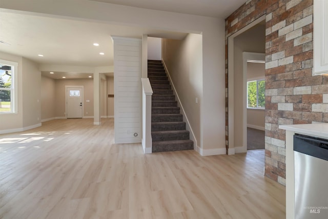 4320 SW 2nd Ave, New Plymouth, ID 83655 - unfurnished living room with stairs, light wood-style flooring, a fireplace, and recessed lighting
