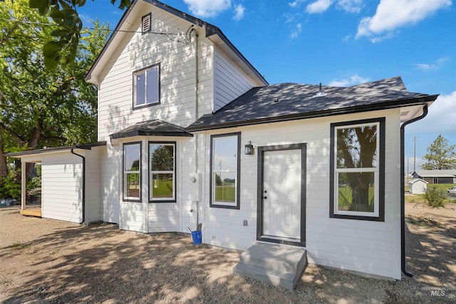 4320 SW 2nd Ave, New Plymouth, ID 83655 - rear view of property featuring a shingled roof and entry steps