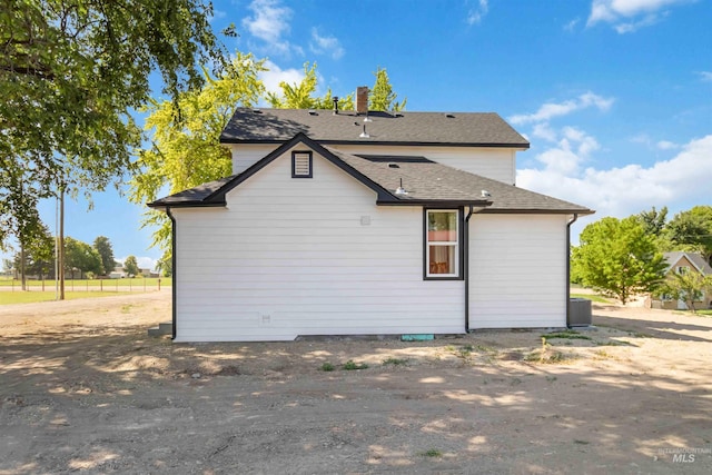 4320 SW 2nd Ave, New Plymouth, ID 83655 - rear view of property featuring a chimney and a shingled roof