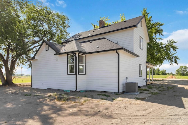 4320 SW 2nd Ave, New Plymouth, ID 83655 - back of house featuring a shingled roof and a chimney