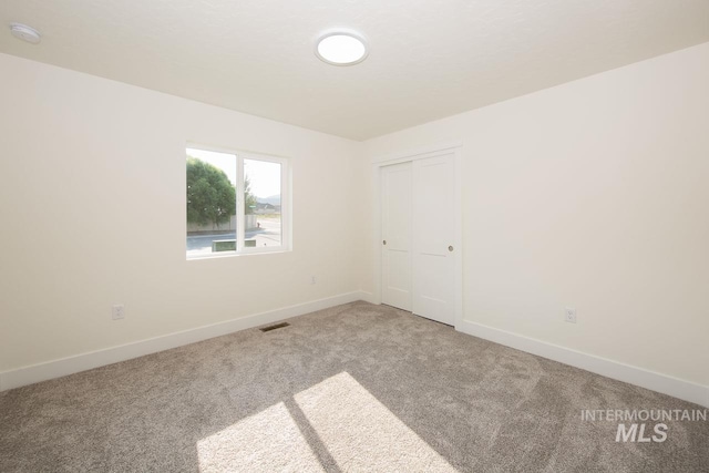 view of carpeted spare room