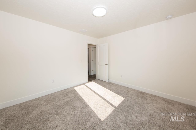 spare room with carpet