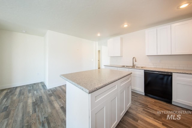 kitchen featuring white cabinetry, black dishwasher, dark hardwood / wood-style floors, and sink