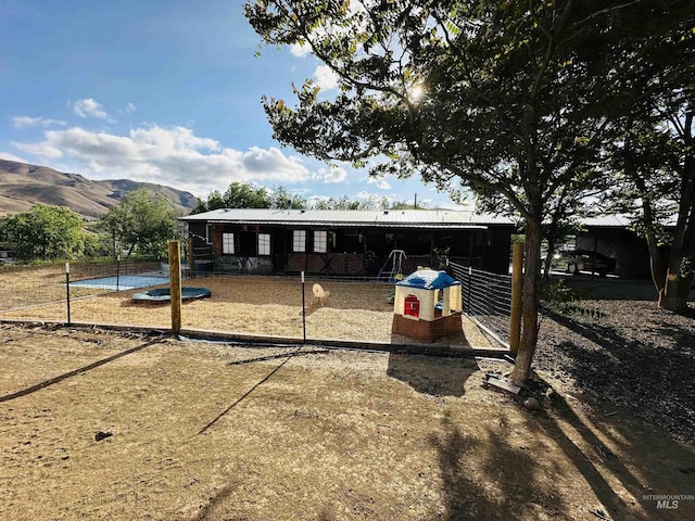 245 W 3rd St, Huntington, OR 97907 - view of front of property featuring metal roof and a mountain view