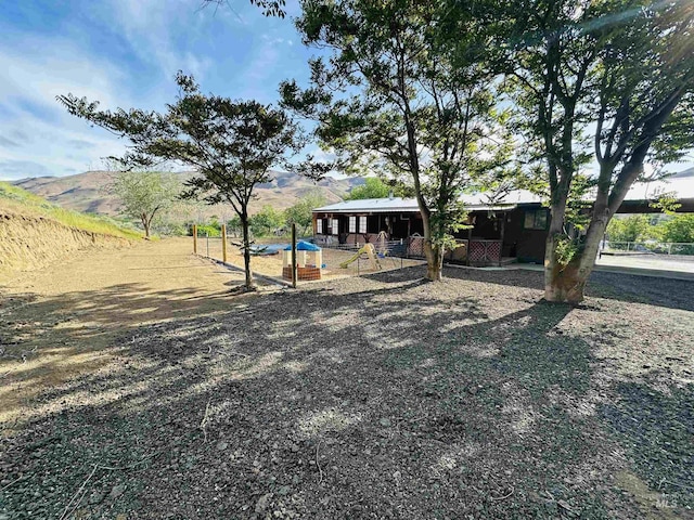 245 W 3rd St, Huntington, OR 97907 - view of yard featuring a mountain view