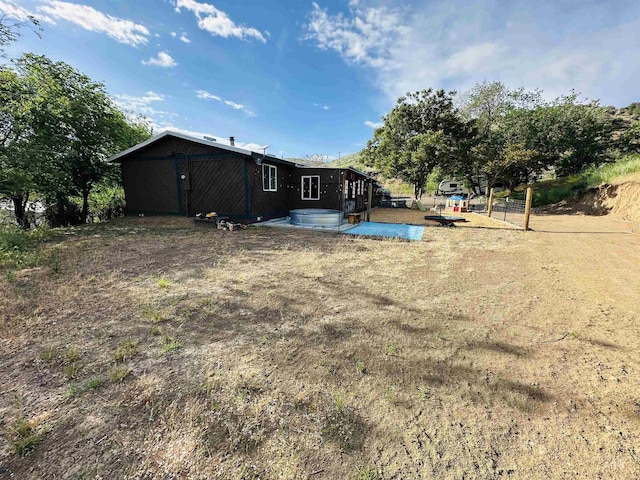 245 W 3rd St, Huntington, OR 97907 - rear view of house with a jacuzzi