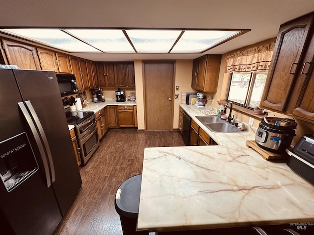 245 W 3rd St, Huntington, OR 97907 - kitchen with black appliances, a sink, and dark wood-style floors