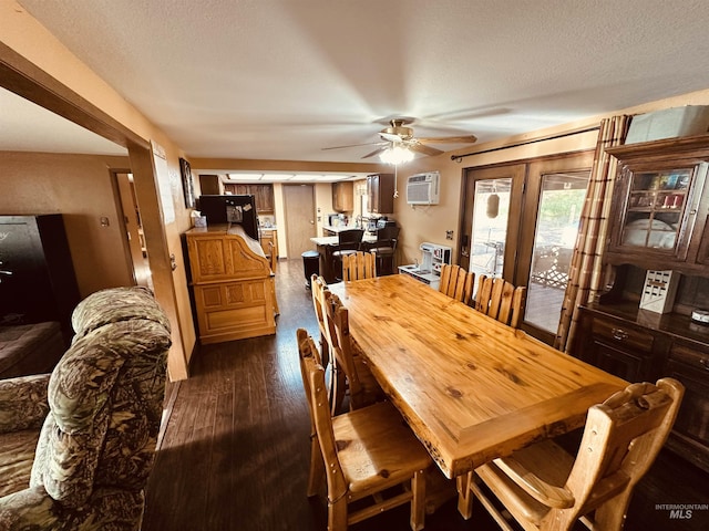 245 W 3rd St, Huntington, OR 97907 - dining area with a wall unit AC, a ceiling fan, dark wood-style flooring, and a textured ceiling