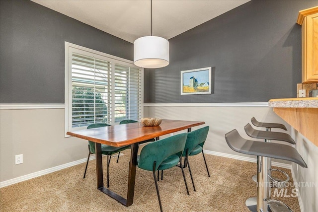 view of carpeted dining area