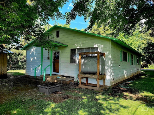 102 N Hornet Creek Rd, Council, ID 83612 - rear view of house with a lawn