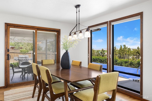 dining space with light wood finished floors