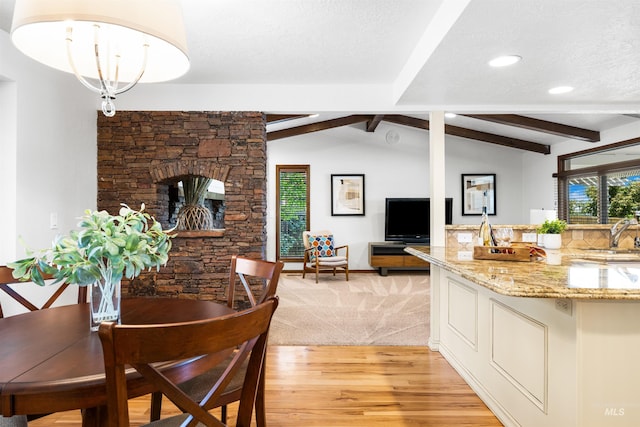 dining area with light wood-style flooring and recessed lighting