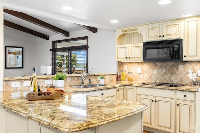 kitchen with cream cabinets, black appliances, a sink, a peninsula, and beamed ceiling
