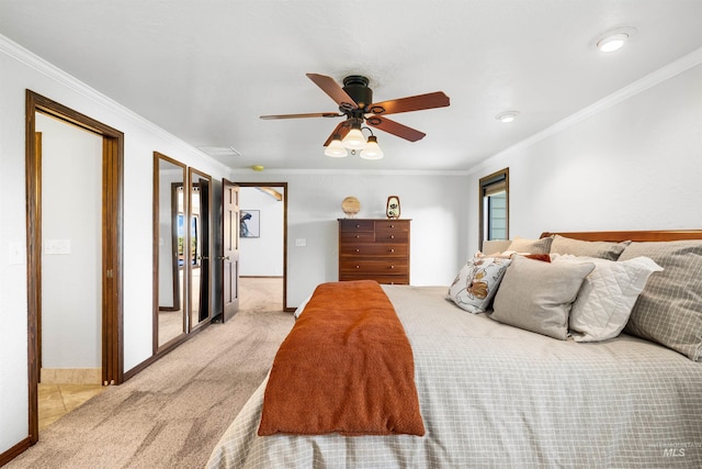bedroom with light colored carpet, crown molding, baseboards, and a ceiling fan