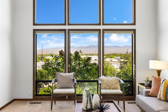 sunroom featuring a mountain view
