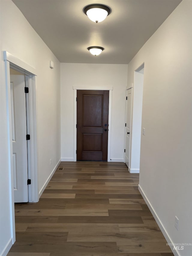 1207 Frank Henry Rd, Twin Falls, ID 83301 - hallway featuring wood finished floors and baseboards