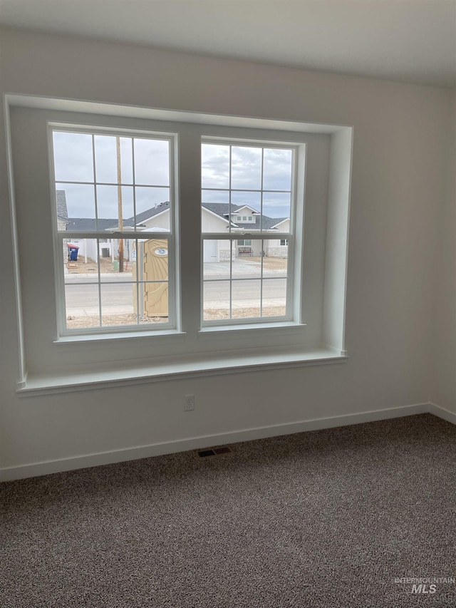 1207 Frank Henry Rd, Twin Falls, ID 83301 - spare room featuring baseboards and carpet flooring