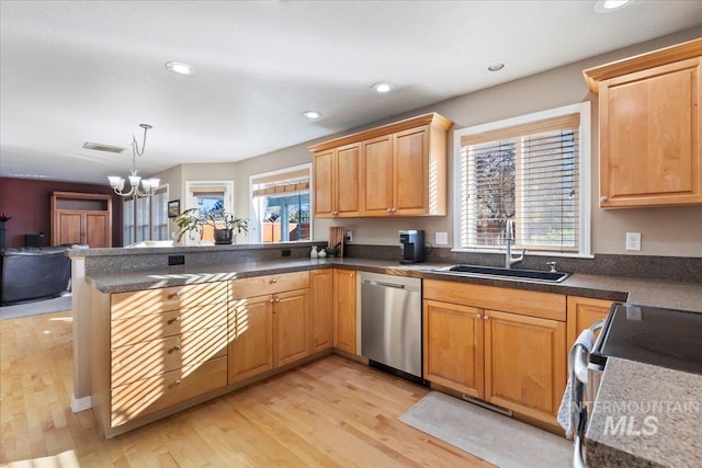 kitchen with sink, hanging light fixtures, light hardwood / wood-style flooring, stainless steel dishwasher, and kitchen peninsula