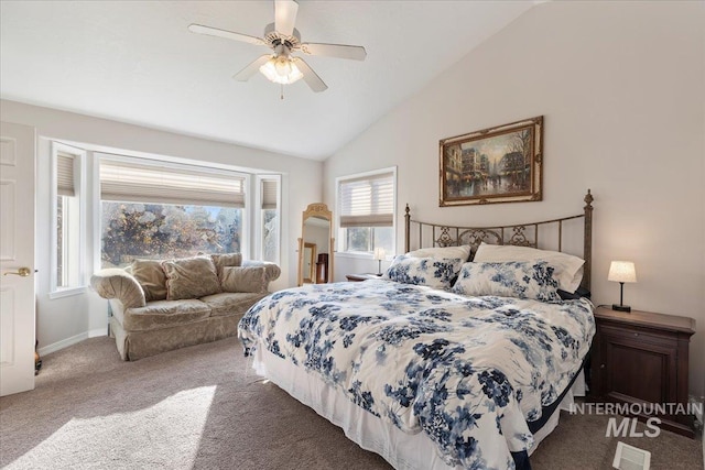 carpeted bedroom with vaulted ceiling and ceiling fan