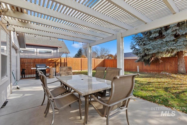 view of patio featuring a grill and a pergola